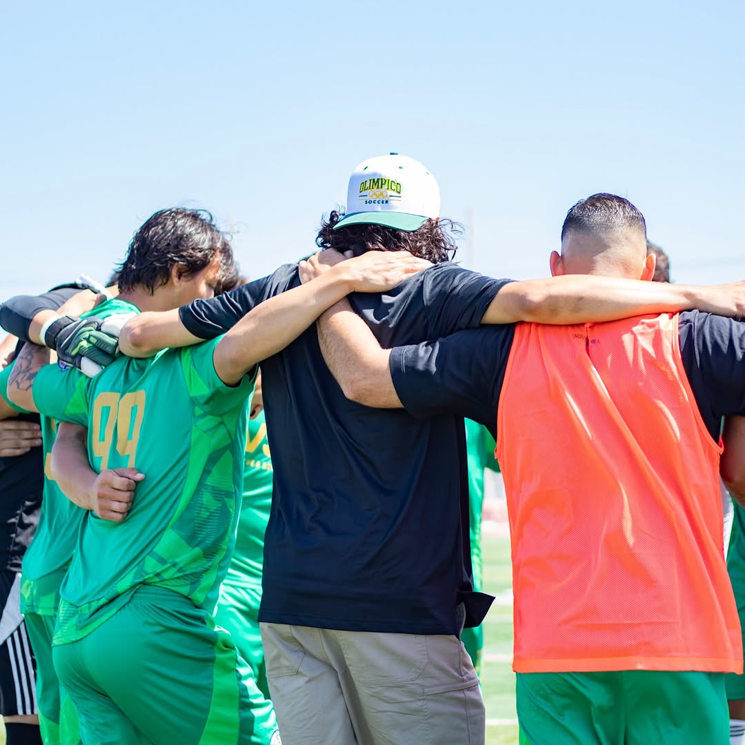 Deportivo Olimpico players together before a match